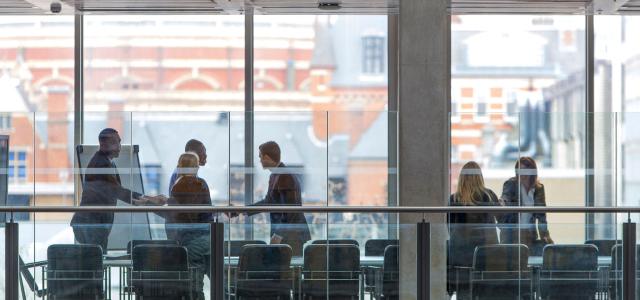 people-shaking-hands-in-a-boardroom